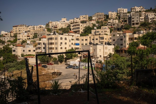 A view of Jenin refugee camp is seen from the Hamadneh family's house in the West Bank, Wednesday, June 5, 2024. Their 15-year-old son Mahmoud was killed by an Israeli sniper on his way home from school. (AP Photo/Bram Janssen)