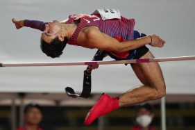 A Paralympian does the high jump at the World Para Athletics Champiionships