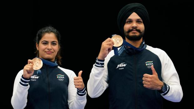 FILE - India's Manu Bhaker, left, and Sarabjot Singh pose for a photograph after winning the bronze medal in the 10m air pistol mixed team event at the 2024 Summer Olympics, Tuesday, July 30, 2024, in Chateauroux, France. (AP Photo/Manish Swarup, File)