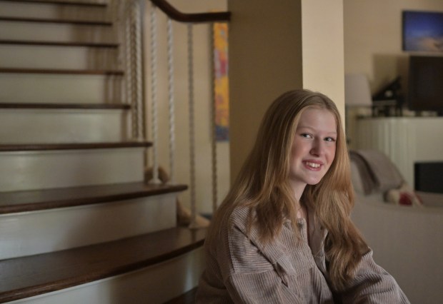 Lydia Pilarowski was one of the first cohort of kids with acute flaccid myelitis back in 2014 when it paralyzed some of the muscles in her upper left arm. Lydia sits for a portrait at her home in Denver on Sept. 12, 2024. (Photo by RJ Sangosti/The Denver Post)