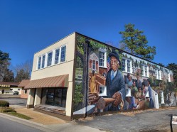Architect B. Kay Van Dyke is opening a co-working space at the T.C. Walker mural building at 6769 Main St. She hopes to attract startups to create a business incubator atmosphere.