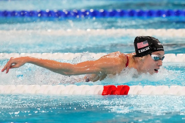 Gretchen Walsh competes Saturday in the mixed 4x100-meter medley relay final at the Olympics in Nanterre, France. Her team set a world record and won gold. TSVANGIRAYI MUKWAZHI/AP