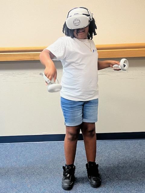 Hampton third graders from Phenix and Andrews recently participated in an activity using virtual reality glasses. During the activity, students used the glasses to virtually "prepare" food. (Photos courtesy of Hampton City Schools)